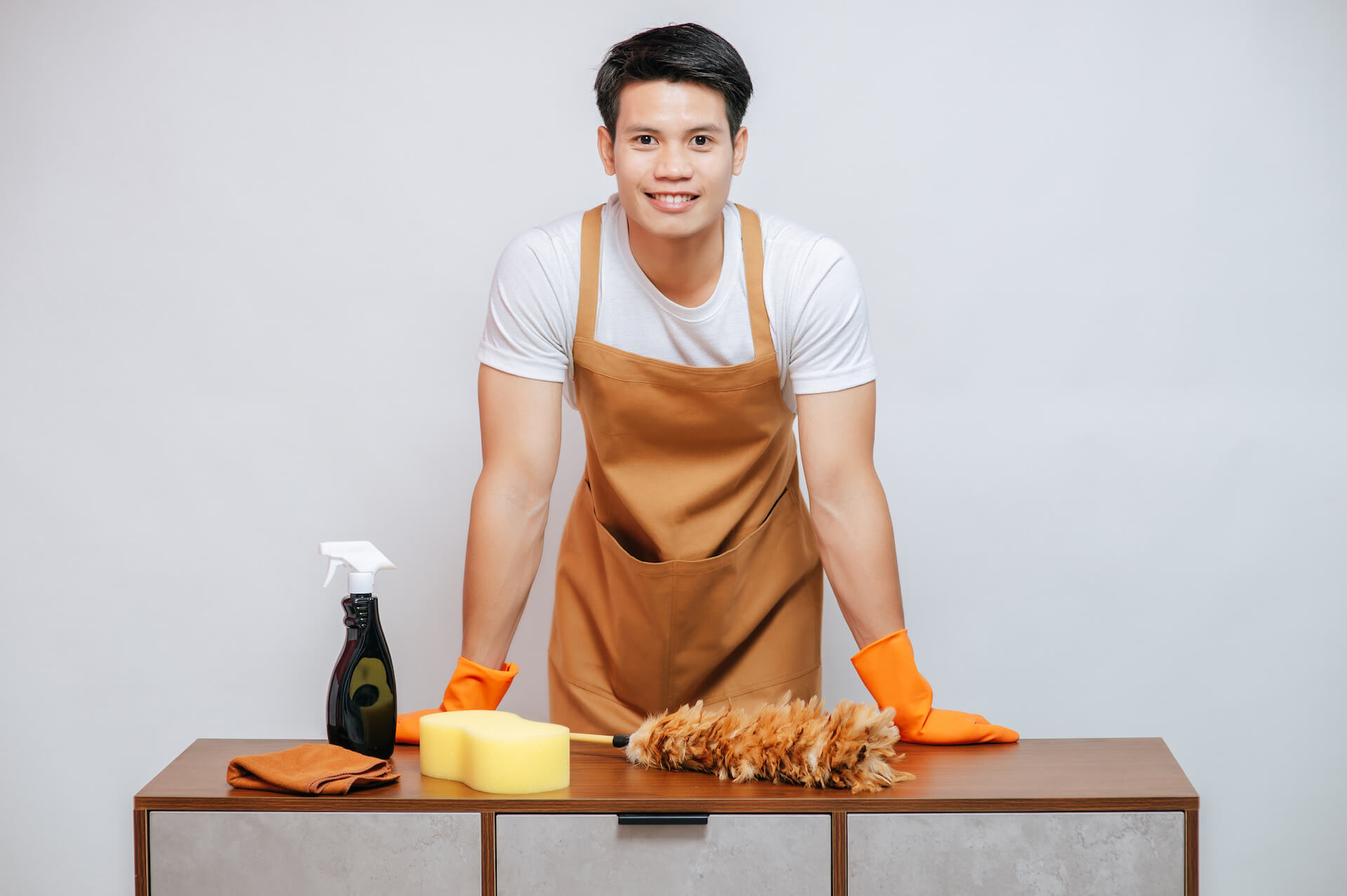 young-man-and-cleaning-equipment-on-furniture-at-h-2021-09-04-01-59-24-utc.jpg